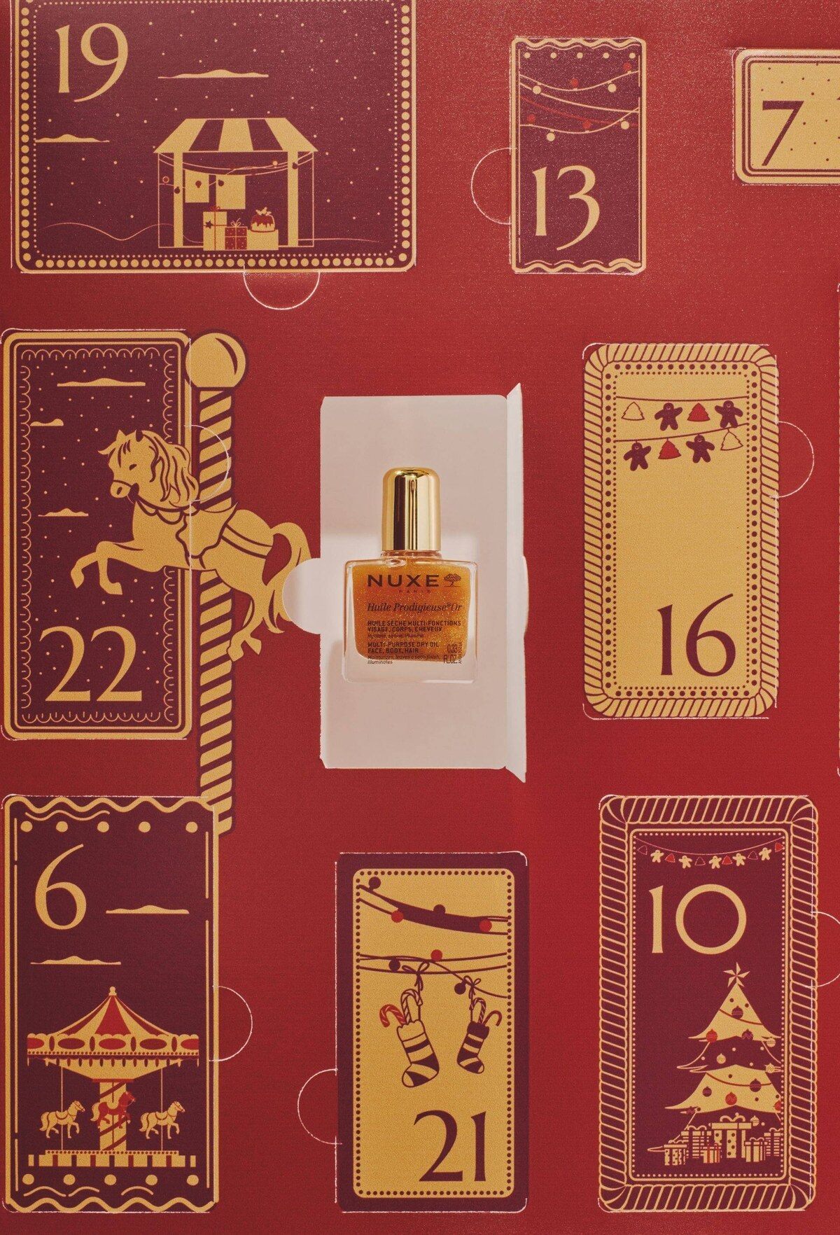 Gros plan sur les cases du calendrier Monoprix, avec une miniature d’Huile Prodigieuse Nuxe dans une fenêtre ouverte