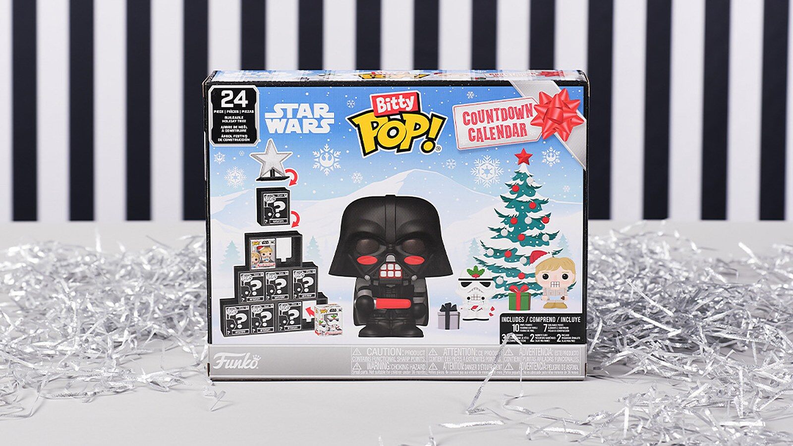 Le calendrier de l’Avent Bitty Pop! Star Wars 2026 de Funko posé sur une table entourée de guirlandes argentées