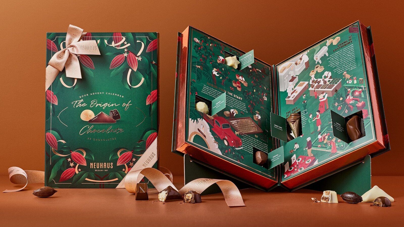 Le Livre Calendrier de l’Avent Neuhaus 2026, fermé et ouvert, entouré de pralines et de rubans dorés