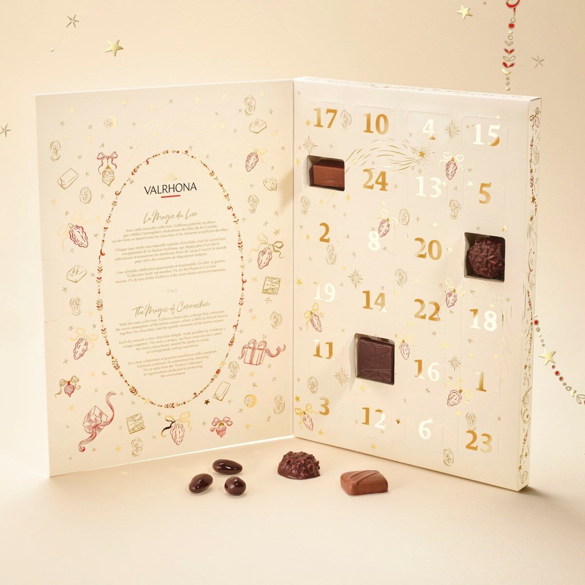 Le calendrier de l’Avent Valrhona 2026 ouvert, avec 24 cases numérotées dorées et quelques chocolats posés devant
